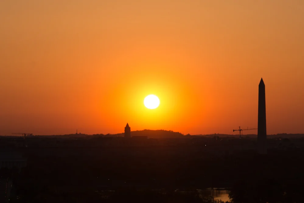 Tele-Zoom of the Sunrise with the Washington Monument as a Silhouette