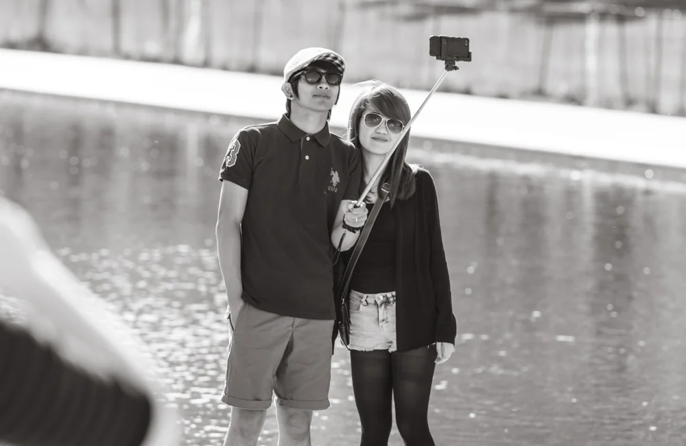As odd as it may look, it keeps you from asking strangers to take your picture just to find out that they were able to bend the laws of physics by having everything in front of you and behind you in focus, while you look like an out-of-focus blob
